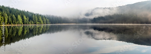 Fototapeta Naklejka Na Ścianę i Meble -  Foggy Landscape. Misty landscape of Lake Saint Anne. 