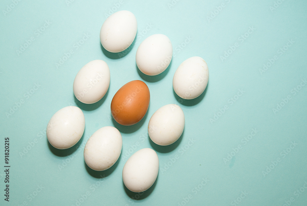 Chicken eggs of different colors on blue surfase Chicken eggs of different colors on blue surfase