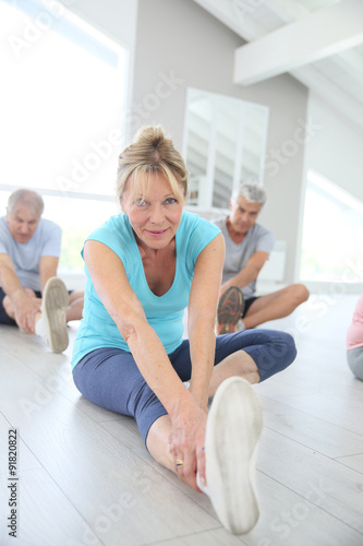 Group of senior people doing stretching exercises