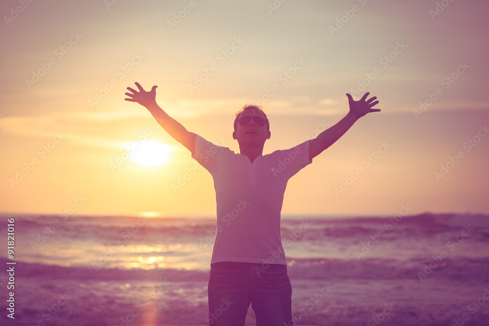 happy man standing on the beach