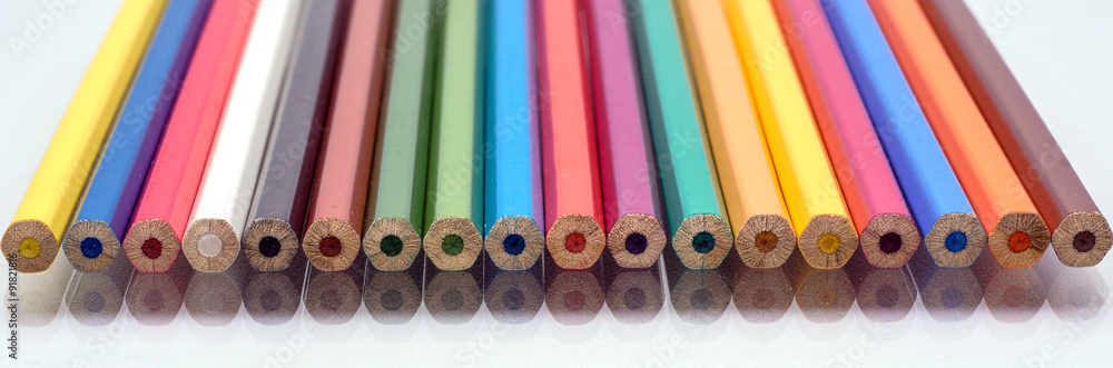 The colored pencils on a white background The colored pencils on a white background