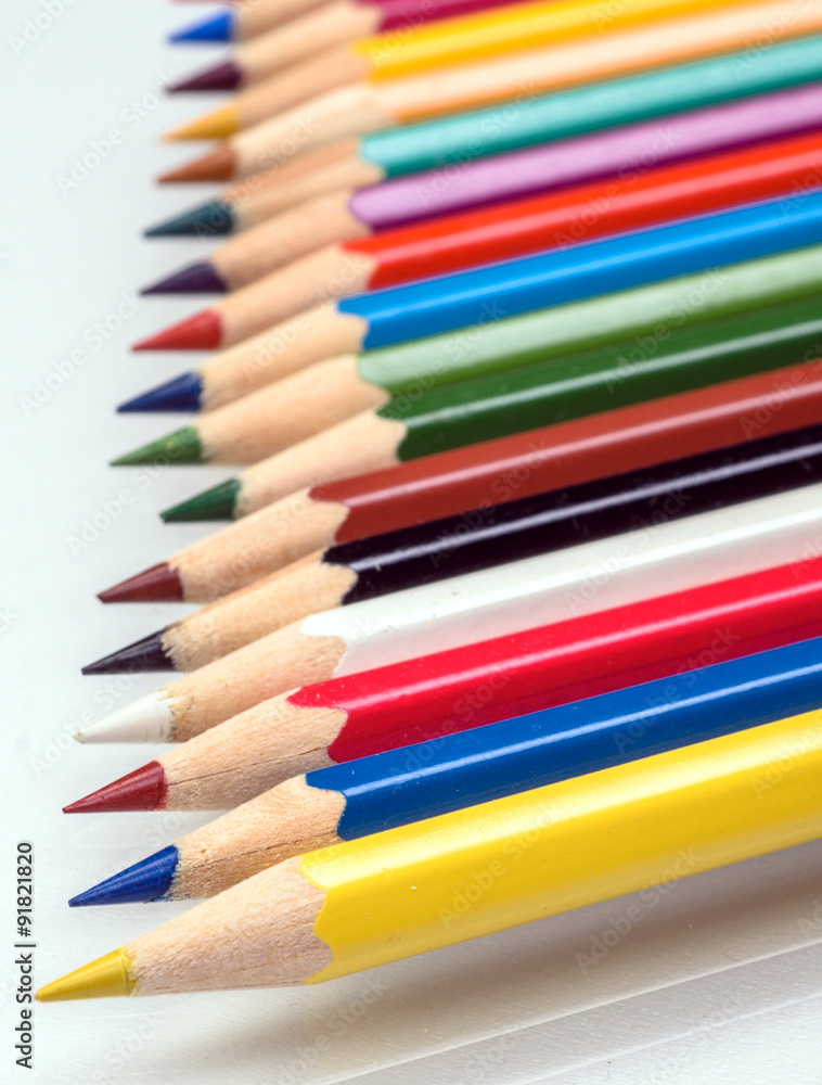 The colored pencils on a white background The colored pencils on a white background