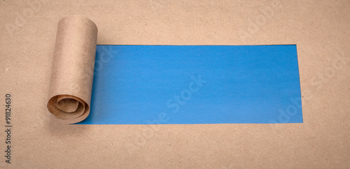 Ripped paper with space for text with blue background
