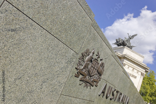 Signage for the Australian War Memorial with the Quadriga atop Wellington Arch behind, Hyde Park Corner, London photo