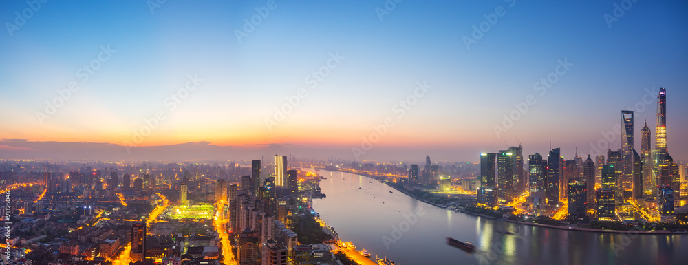 skyscrapers of the city in China around a river at dusk
