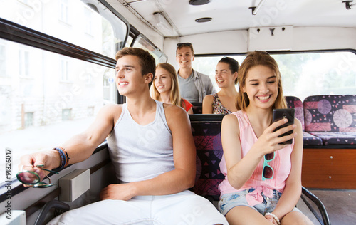 happy teenage friends traveling by bus © Syda Productions