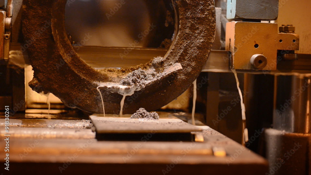 Machine with a wide metal band saw using an oilbased lubricant Stock