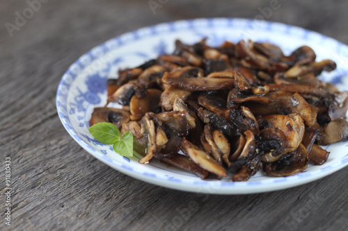 fried mushrooms on gray wooden background