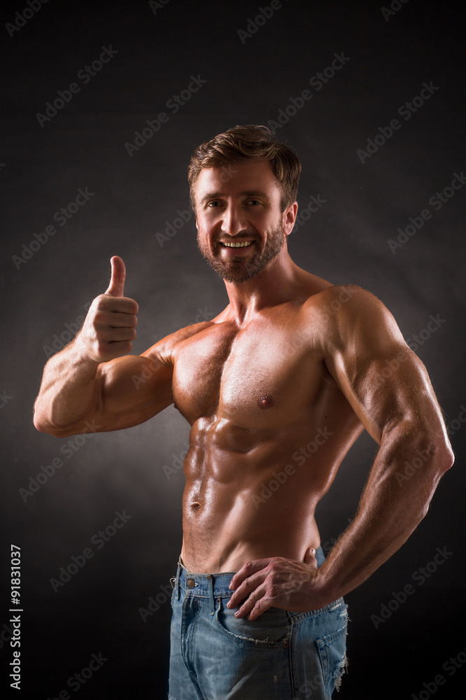 Smiling shirtless mascular man Smiling shirtless mascular man