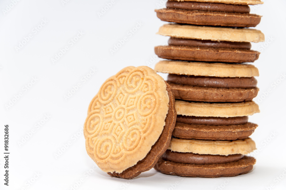 Side view chocolate sandwich biscuits over white Side view chocolate sandwich biscuits over white