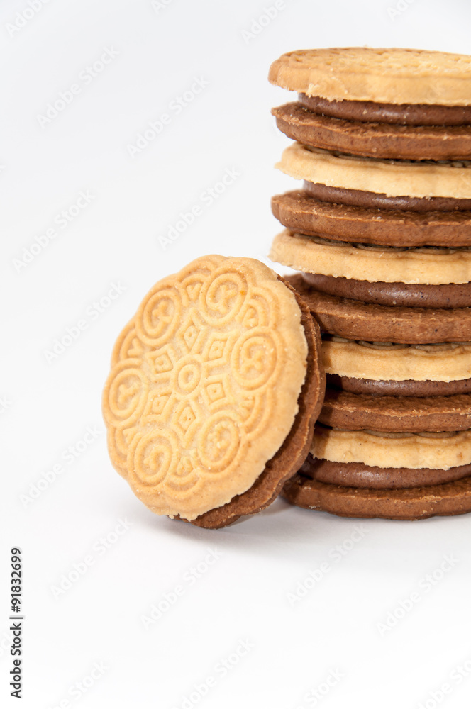 Side view chocolate sandwich biscuits over white Side view chocolate sandwich biscuits over white