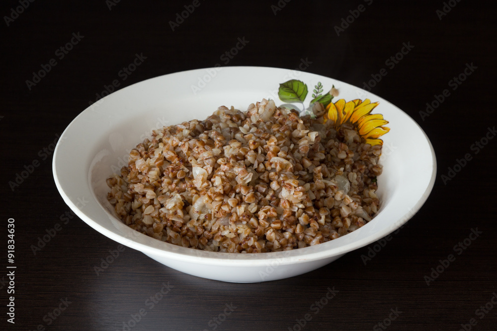 Buckwheat with onion in the plate Buckwheat with onion in the plate