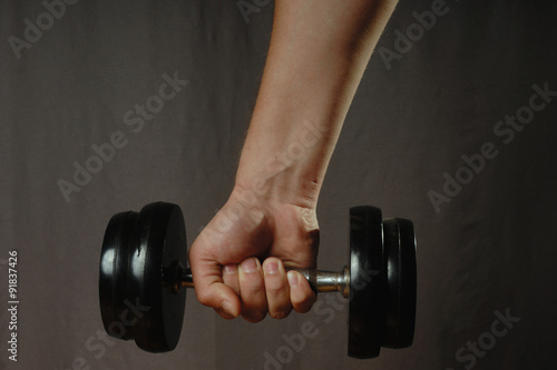 One hand, one dumbbell.