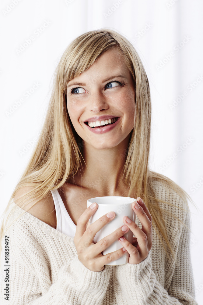 Young blond woman enjoying coffee Young blond woman enjoying coffee