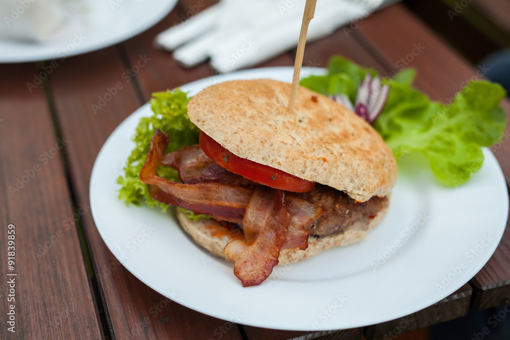 A close-up of tasty- look hamburger. A close-up of tasty- look hamburger.