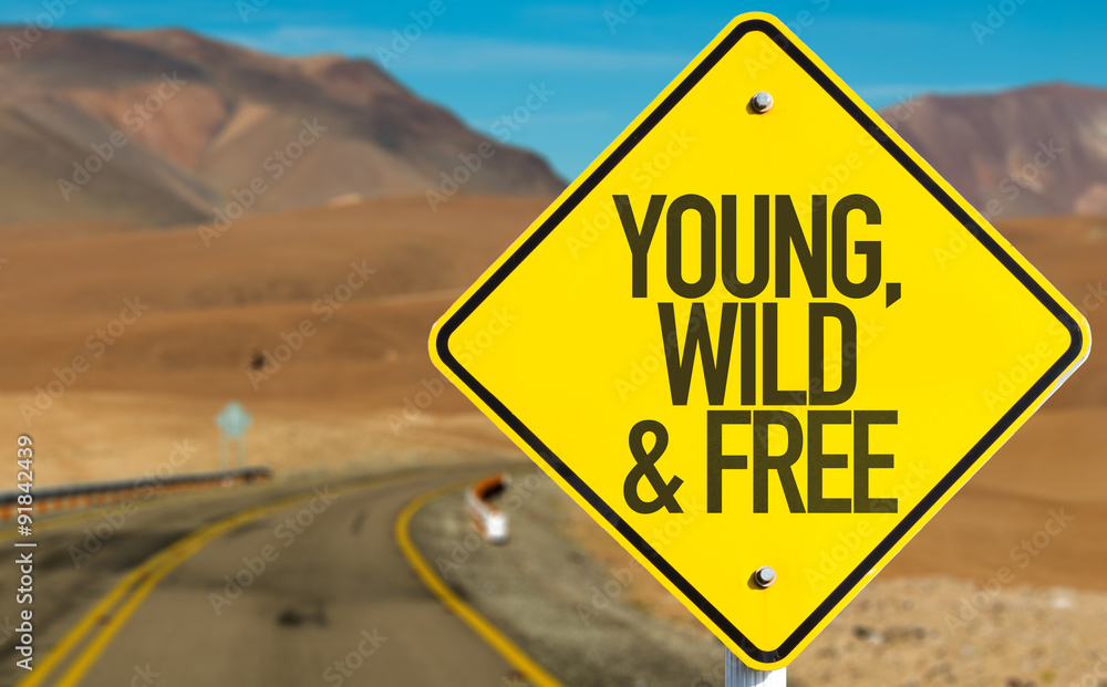 Young, Wild & Free sign on desert road