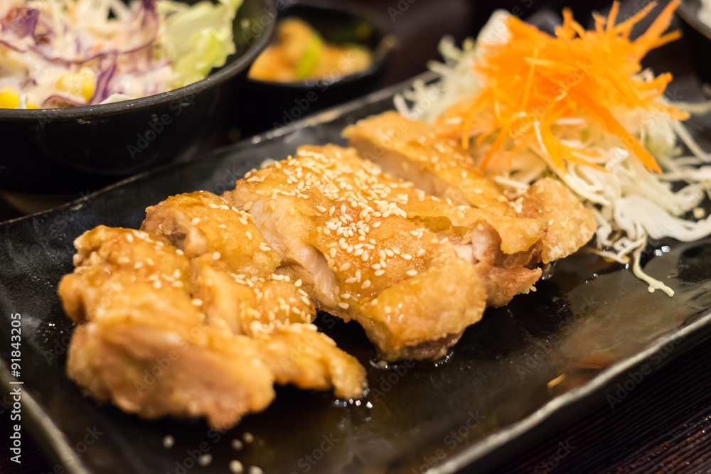 Teriyaki chicken on black plate Teriyaki chicken on black plate