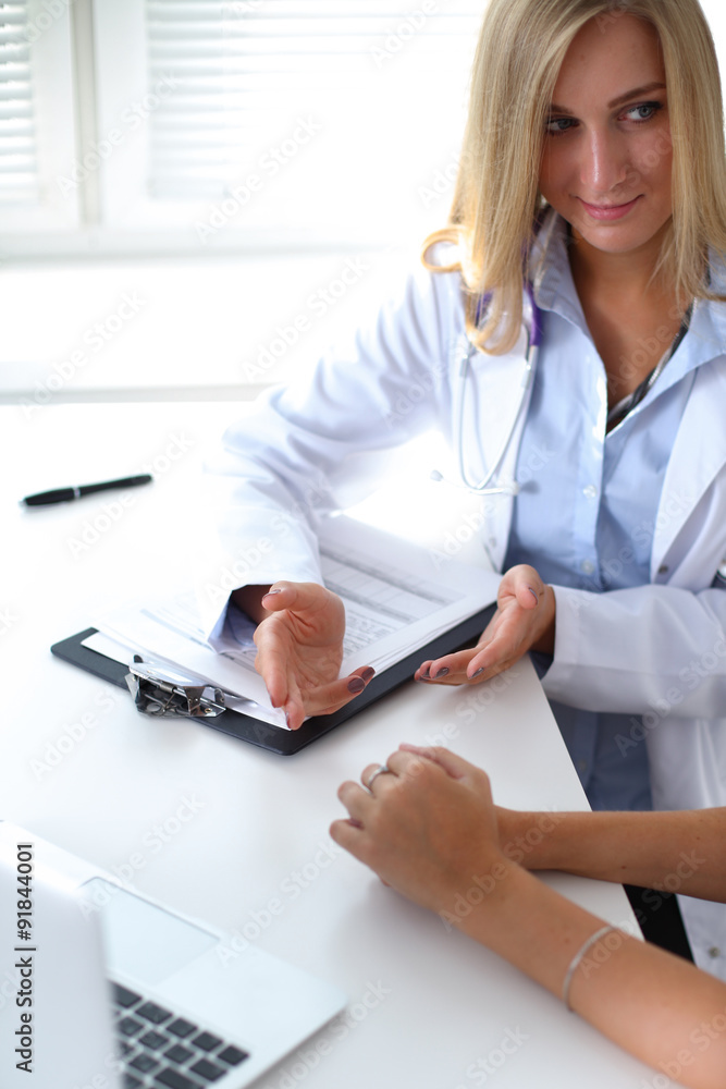 Doctor and patient are discussing something, just hands at the table