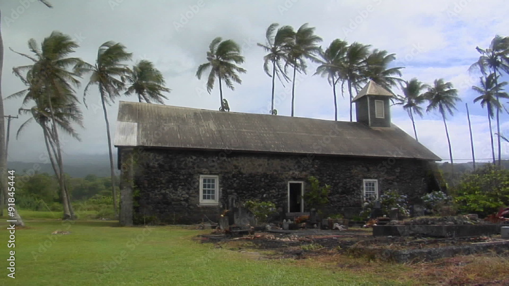 A church stands on a tropical island during a wind storm. A church stands on a tropical island during a wind storm.