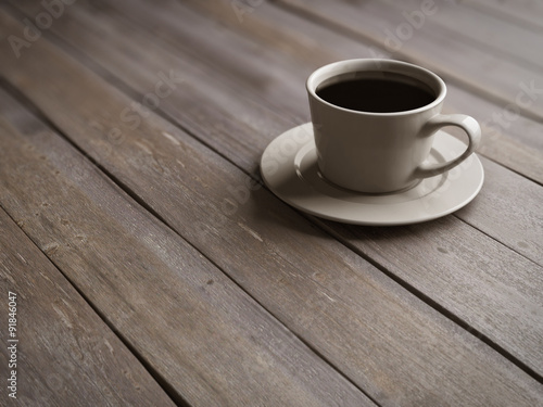 Cup of coffee on wooden boards