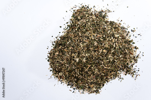 A bunch of nettle tea over white surface