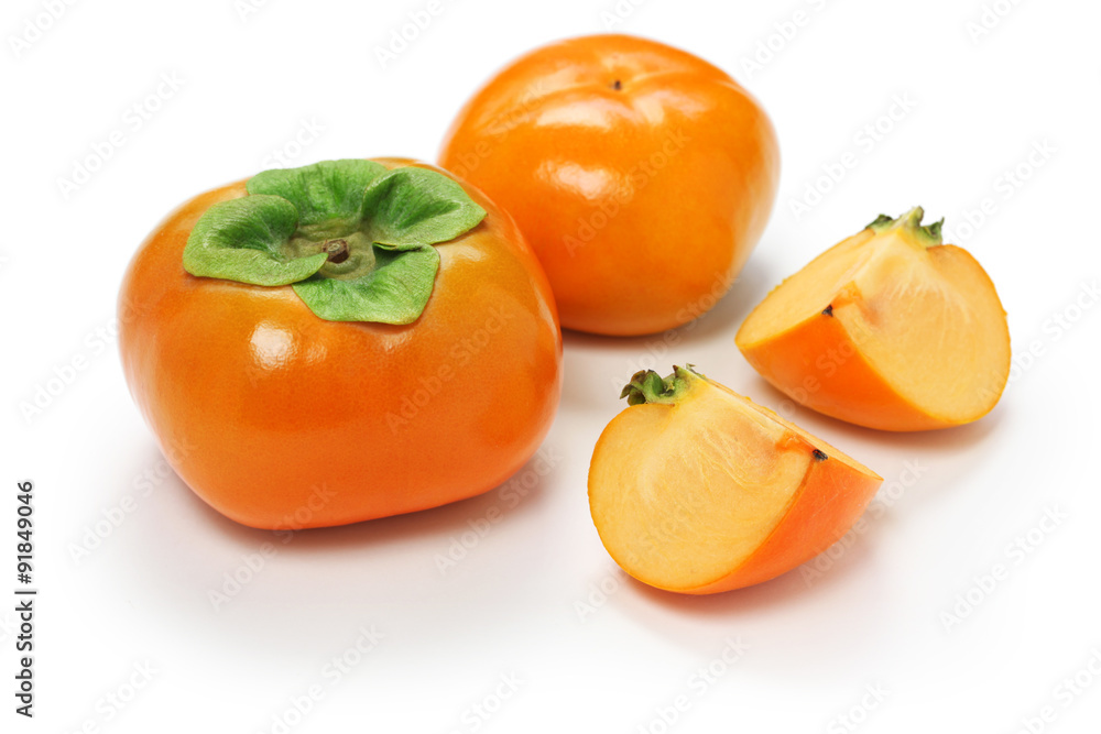 jiro kaki, japanese persimmon isolated on white wooden background
jiro kaki, japanese persimmon isolated on white wooden background