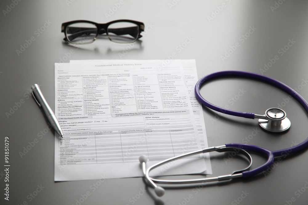 Stethoscope on the grey desk, close up Stethoscope on the grey desk, close up