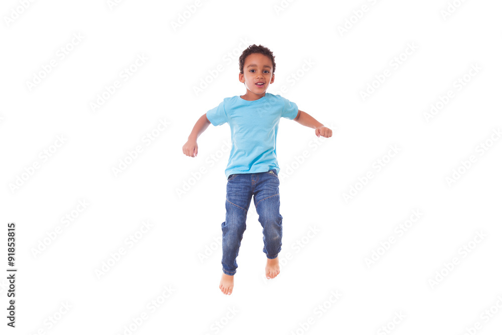 Portrait of a cute little African American boy jumping on a tram Portrait of a cute little African American boy jumping on a tram