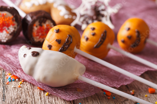 Cake pops pumpkins and spooky for Halloween. horizontal 