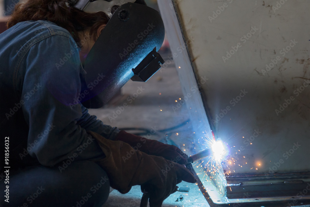Worker welding the steel structure Worker welding the steel structure