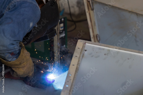 Worker welding the steel structure