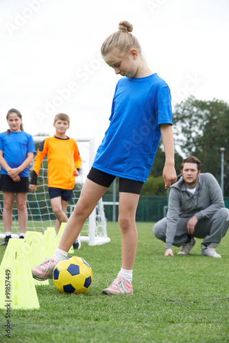 Coach Leading Outdoor Soccer Training Session