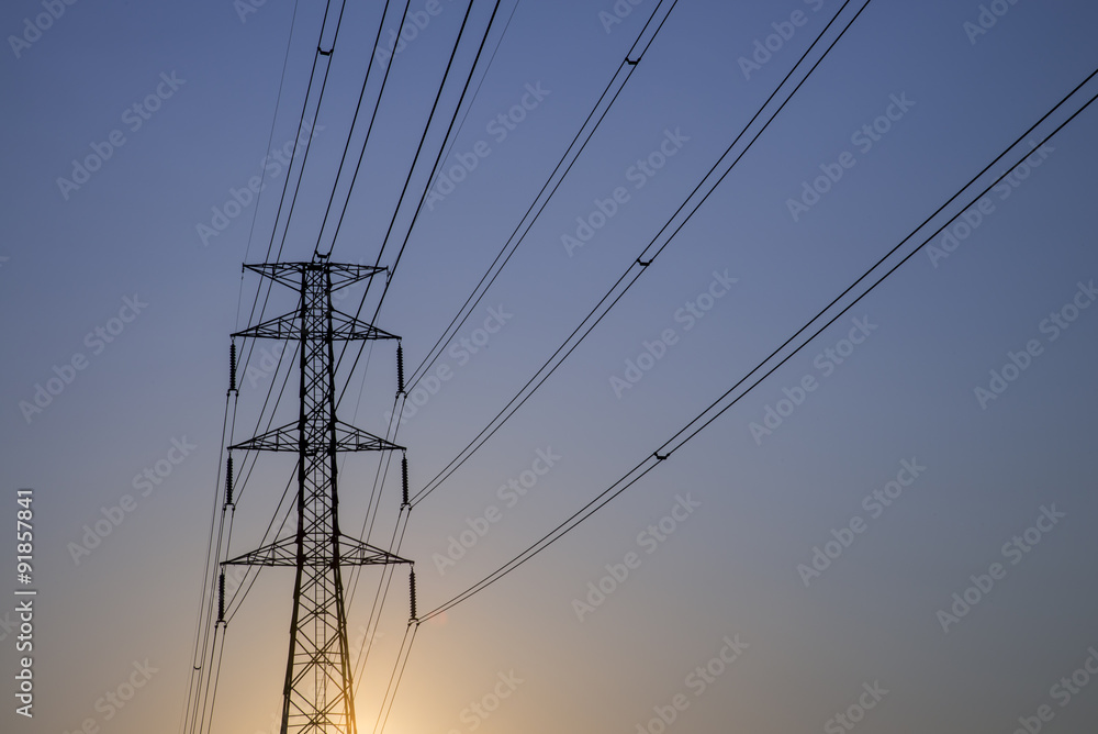 silhouette High voltage electricity pylon sunset