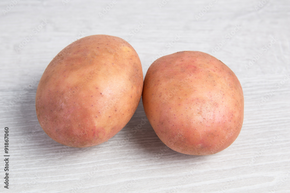potatoes on a wooden background potatoes on a wooden background