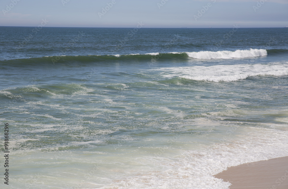 Wave of the sea on the sand beach
