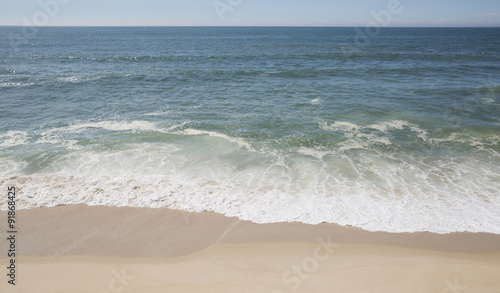 Wave of the sea on the sand beach 