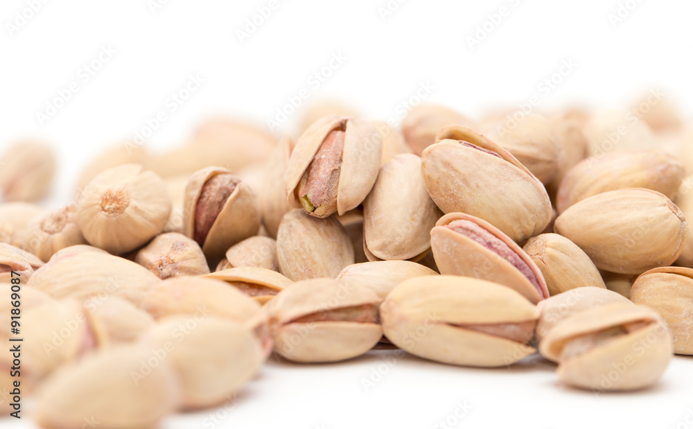 pistachios on a white background. close pistachios on a white background. close