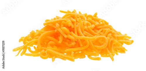 Portion of shredded sharp cheddar cheese on white background