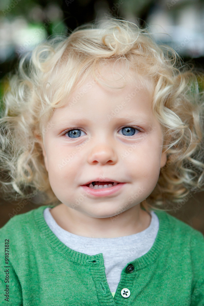Little baby boy with curl hair and blue eyes Little baby boy with curl hair and blue eyes