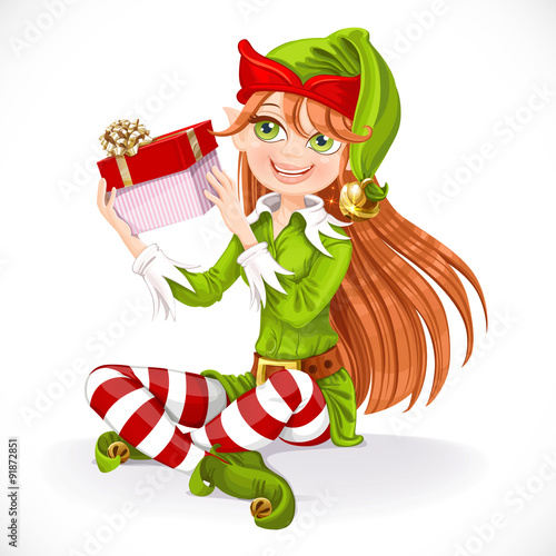 Cute girl Santa elf sit on floor hold gift