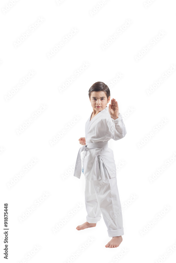 Boy in a kimono practicing martial arts and jiu jitsu