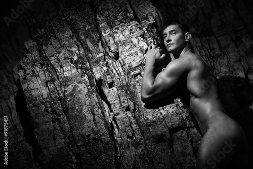 Fashion portrait of a sporty, athletic, muscular sexy nude man