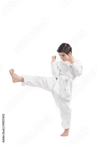 Boy in a kimono practicing martial arts and jiu jitsu