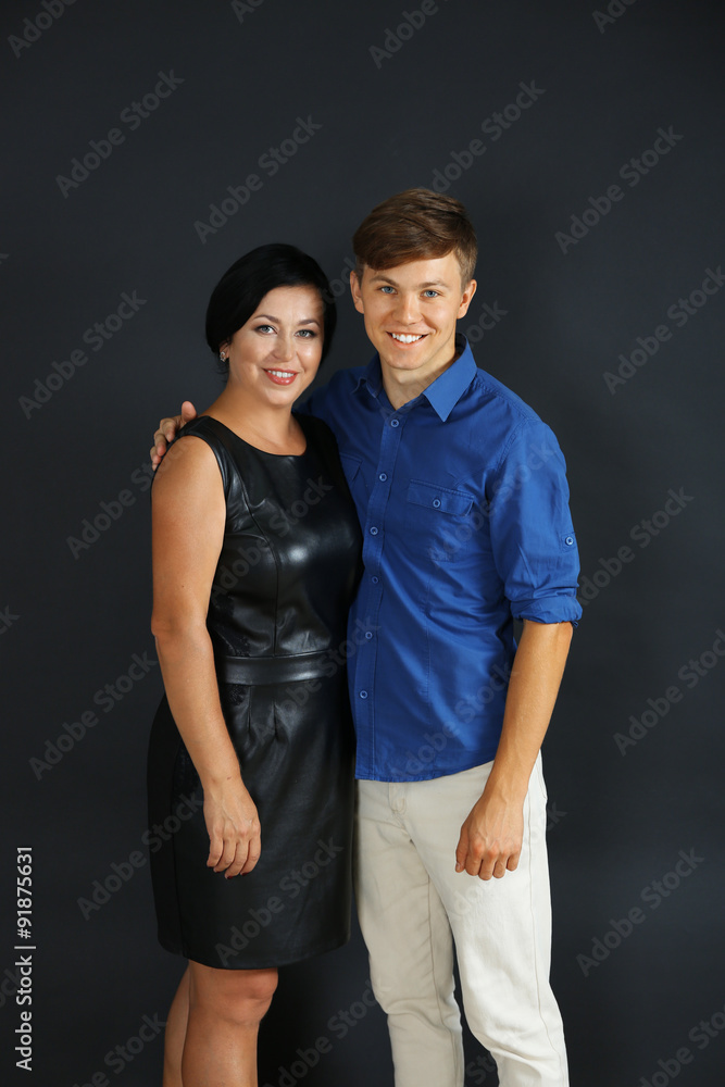 Portrait of mother and her son on dark background Portrait of mother and her son on dark background