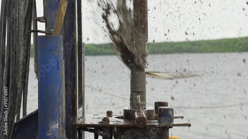 muddy water jets from drilling pipe slow motion