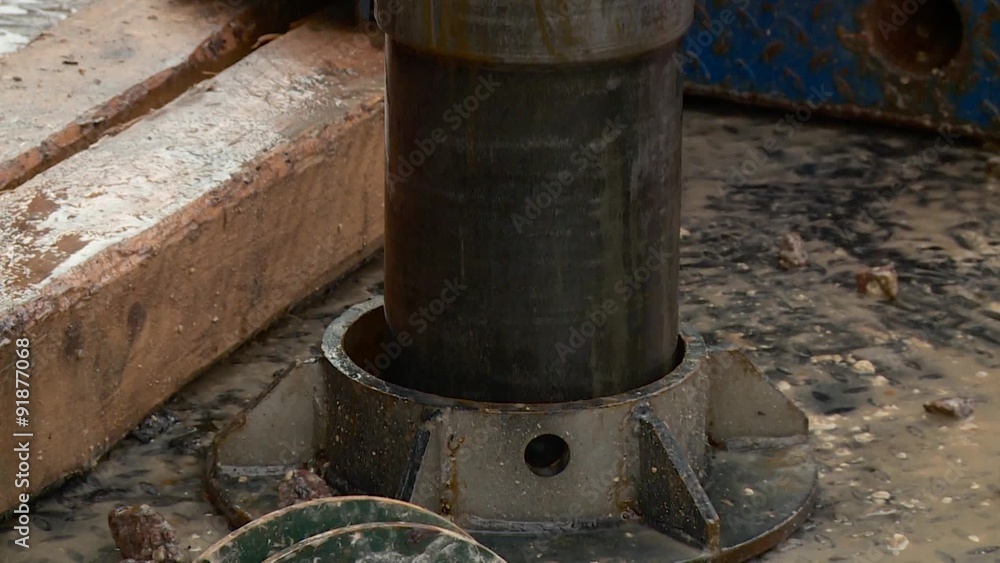 Immersing casing pipe into the borehole Immersing casing pipe into the borehole
