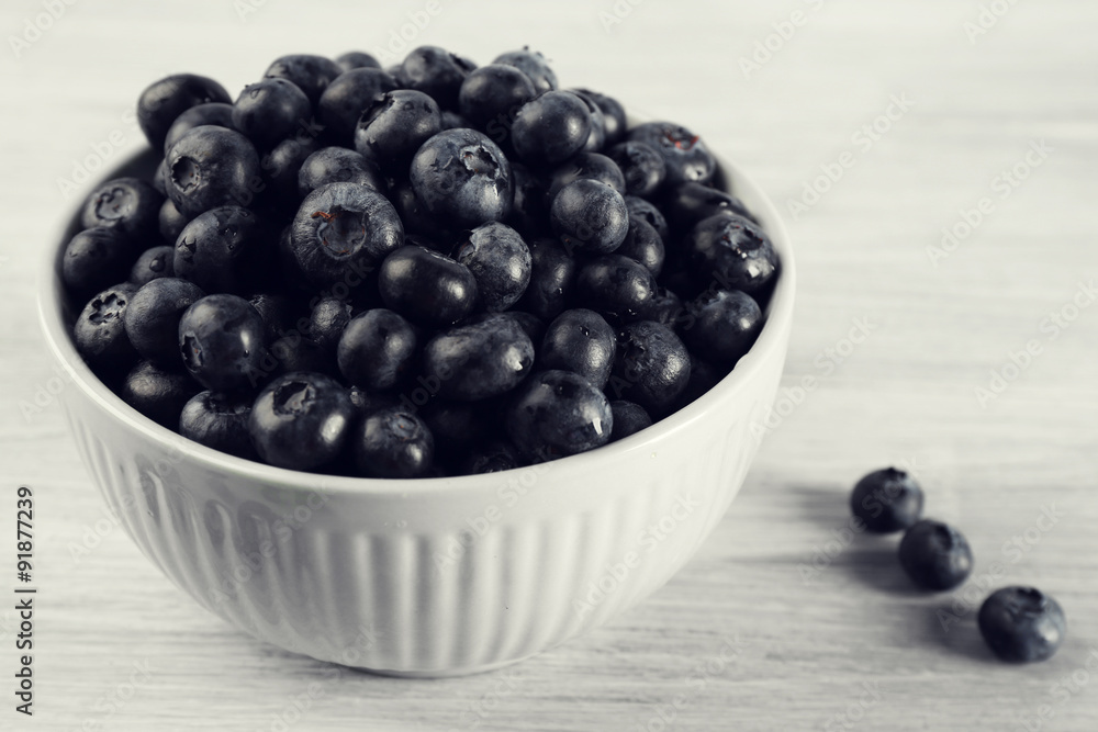 Fresh blueberries in bowl on table close up Fresh blueberries in bowl on table close up