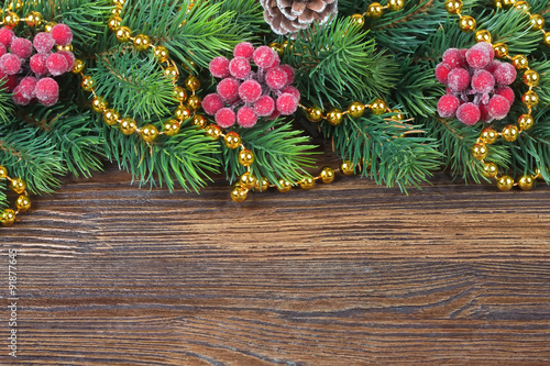 Christmas fir tree with decoration wooden background