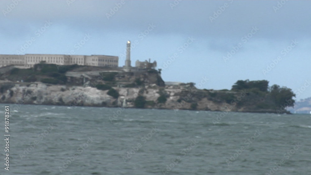 A seagull stands on a wall across from Alcatraz Island. A seagull stands on a wall across from Alcatraz Island.