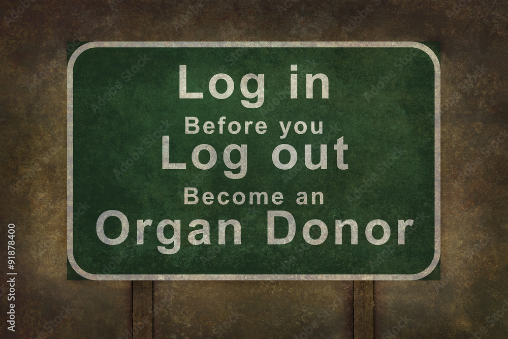 Log in before you log out become an organ donor roadside sign, with ominous background